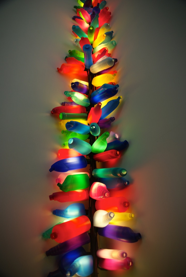 Colorful illuminated art installation in a gallery.
